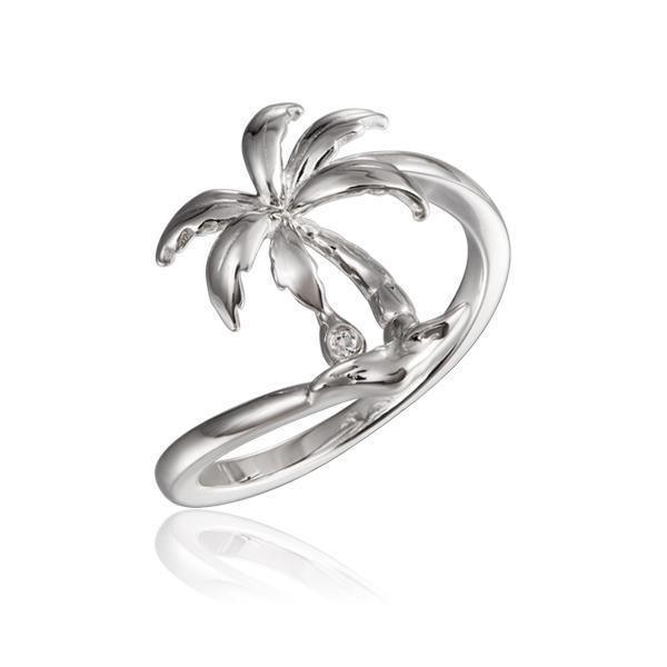 In this photo there is a 925 sterling silver beachside palm tree ring with a topaz gemstone.