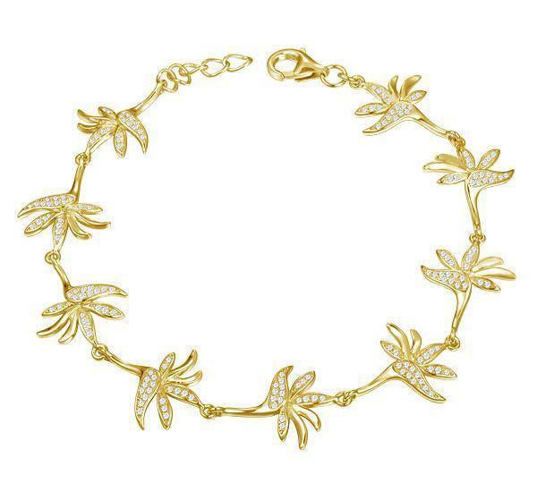 In this photo there is a yellow gold plated bird of paradise bracelet with topaz gemstones.