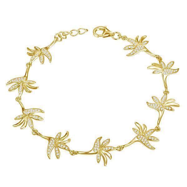 In this photo there is a yellow gold plated bird of paradise bracelet with topaz gemstones.