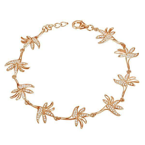 In this photo there is a rose gold plated bird of paradise bracelet with topaz gemstones.