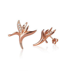 The picture shows a pair of 14K rose gold bird of paradise stud earrings paired with diamonds.