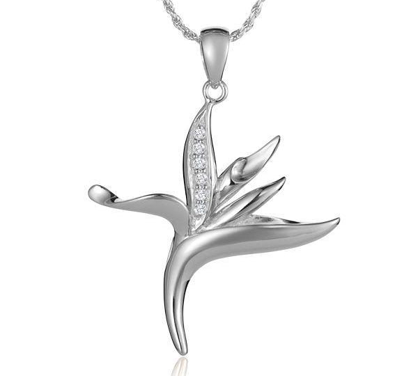 In this photo there is a sterling silver bird of paradise pendant with topaz.