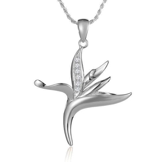 In this photo there is a sterling silver bird of paradise pendant with topaz.