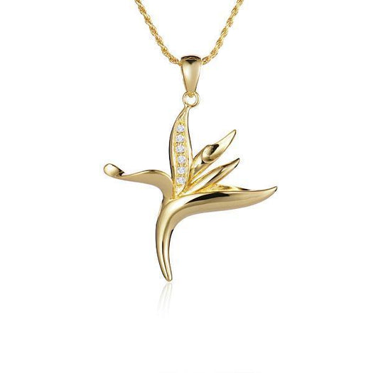 In this photo there is a small yellow gold bird of paradise pendant with diamonds.