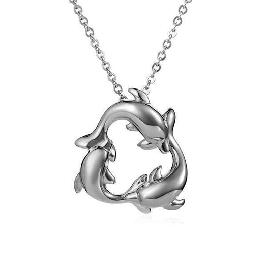 The picture shows a small pendant made of 14K white gold featuring a circle of dolphins.