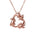 The picture shows a small 14K rose gold circle of dolphins pendant.