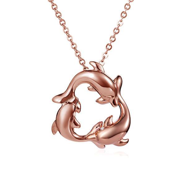 The picture shows a small 14K rose gold circle of dolphins pendant.