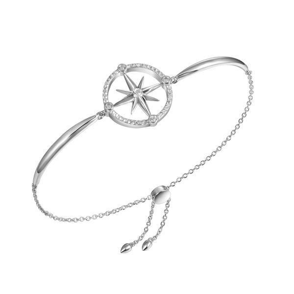 In this photo there is a sterling silver compass bracelet with topaz gemstones.