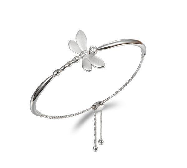 In this photo there is a sterling silver dragonfly bracelet with topaz gemstones.