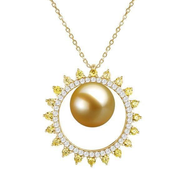 In this photo there is a yellow gold sun pendant with one golden south sea pearl and white and yellow diamonds.