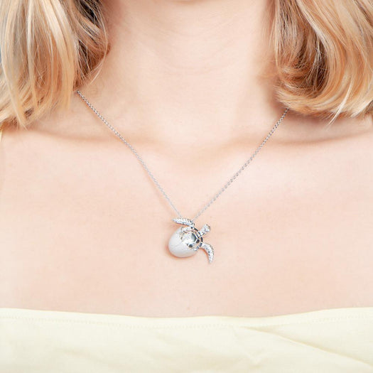 The picture shows a 925 sterling silver sea turtle hatchling pendant.