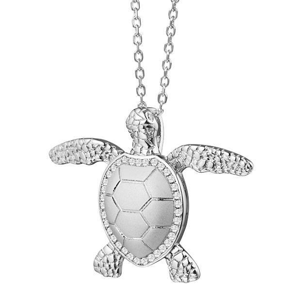 The picture shows a 925 sterling silver, white gold plated, sea turtle pendant with topaz.