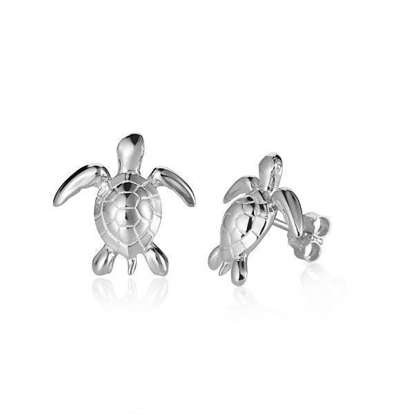 The picture shows a small pair of 14K white gold sea turtle earrings.