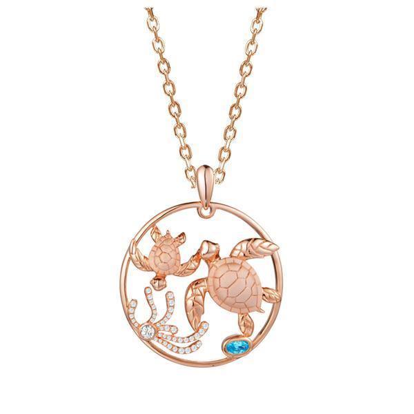 The picture shows a 14K rose gold circle pendant featuring two sea turtles, sea weed made of diamonds and  aquamarine.