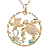 The picture shows a 925 sterling silver, yellow gold plated, eternity pendant with two sea turtles and seaweed with  aquamarine.