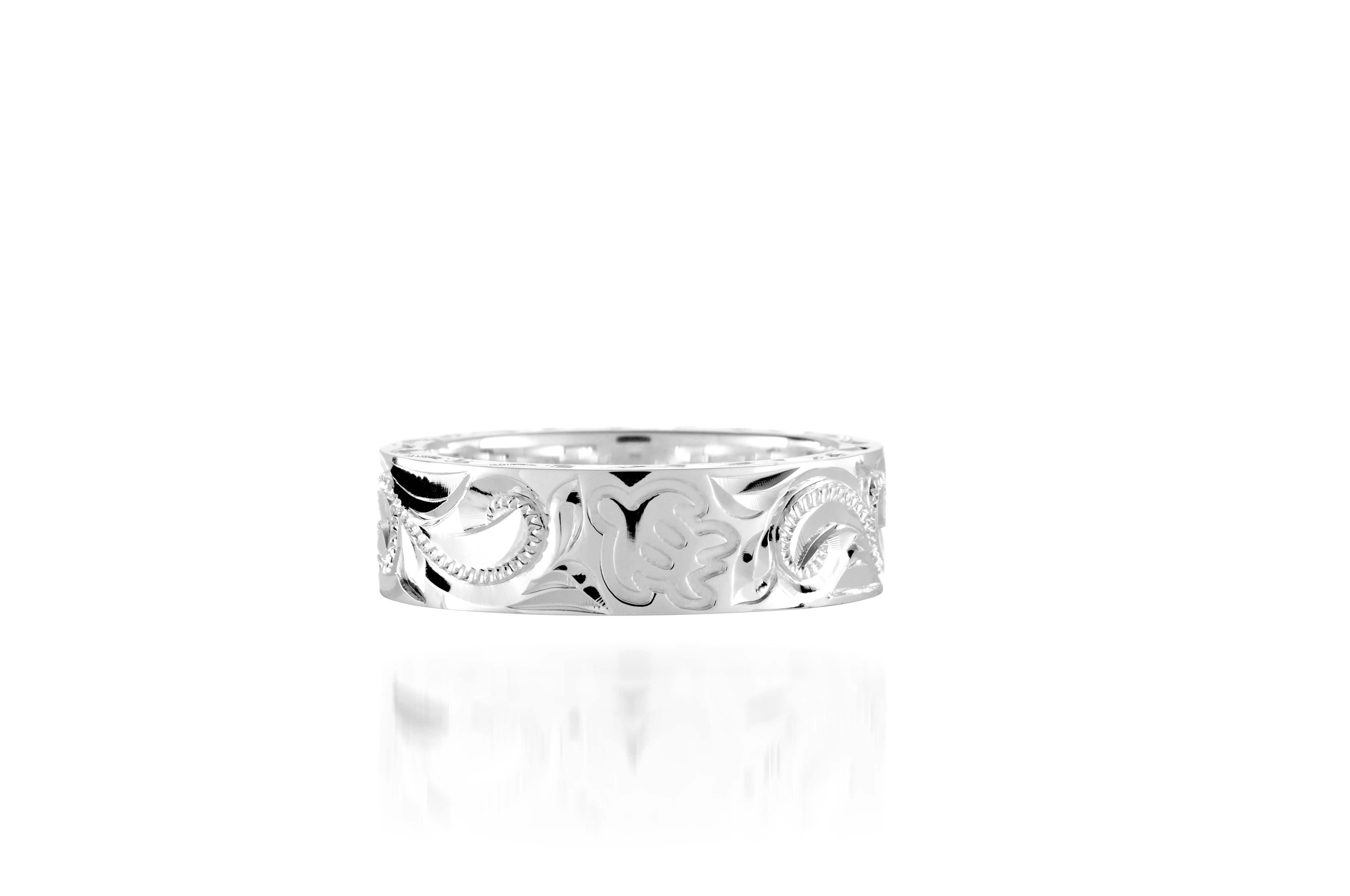 The picture shows a 925 sterling silver 6mm ring with hand engravings including sea turtles.