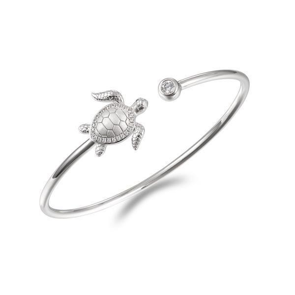 The picture shows a 925 sterling silver sea turtle bangle with topaz.