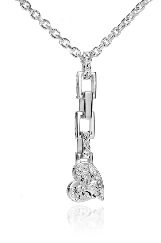 The picture shows a 925 sterling silver heart pendant with hand-engraved designs including a plumeria paired with topaz.