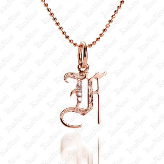 The picture shows a 14K rose gold Koa Nani F initial pendant.