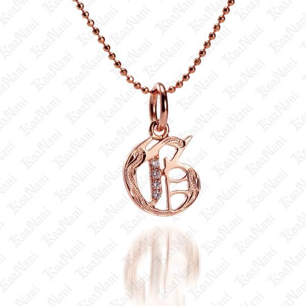 The picture shows a 14K rose gold Koa Nani G initial pendant.