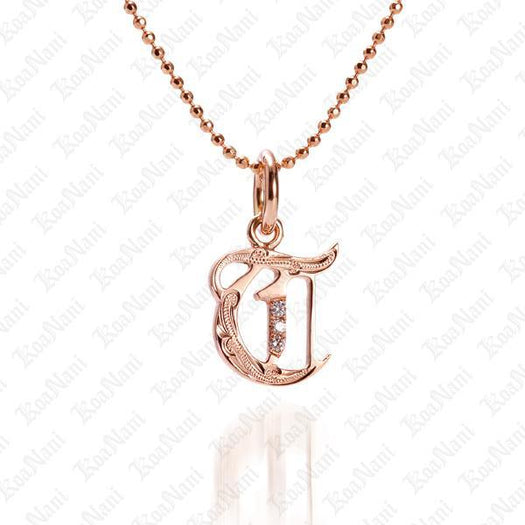 The picture shows a 14K rose gold Koa Nani T initial pendant.