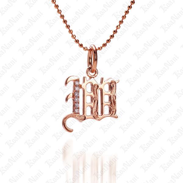 The picture shows a 14K rose gold Koa Nani W initial pendant.