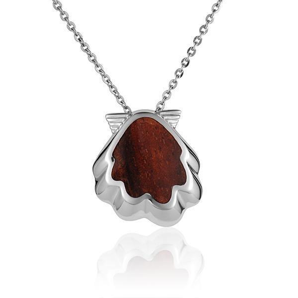 In this photo there is a sterling silver and koa wood oyster shell pendant.