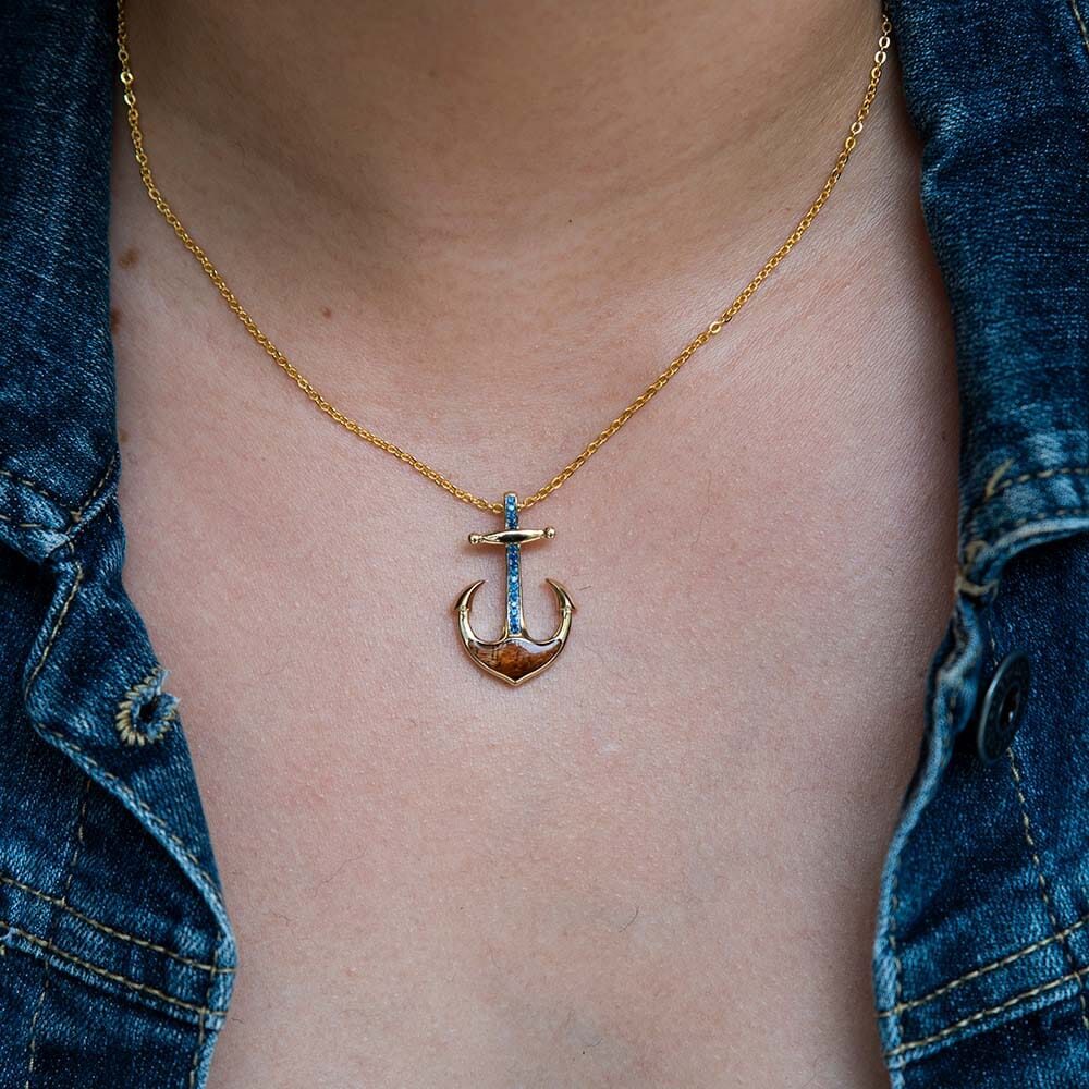 14k Gold Anchor pendant, with Koa Wood and blue  sapphire. on a golden 16" to 18" cable chain. 