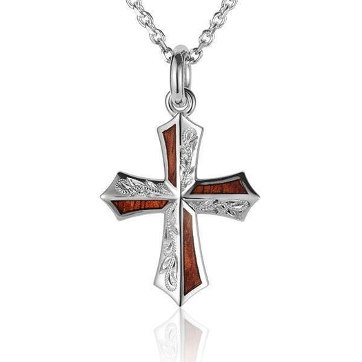 In this photo there is a sterling silver and koa wood cross pendant with hand engravings.