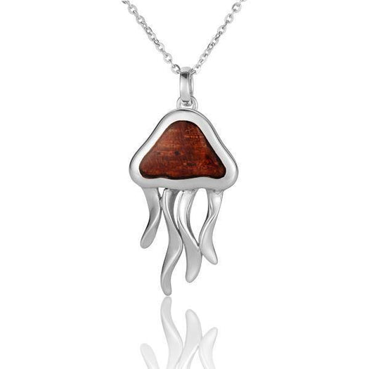 In this photo there is a sterling silver and koa wood jellyfish pendant.