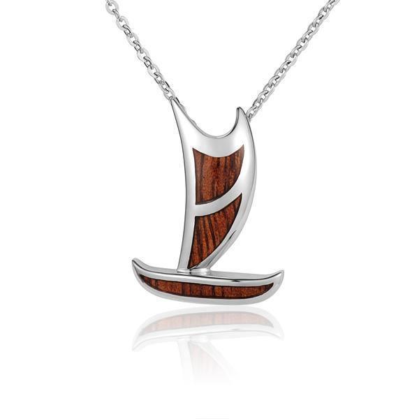In this photo there is a sterling silver and koa wood sailboat pendant.