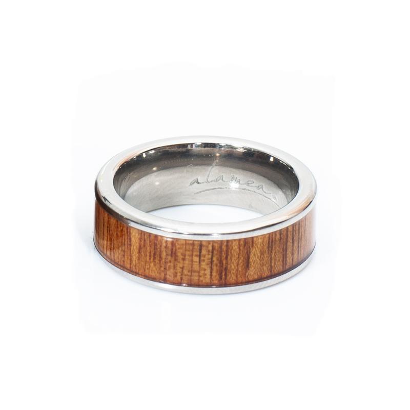 In this photo there is a ring made of koa wood and titanium.