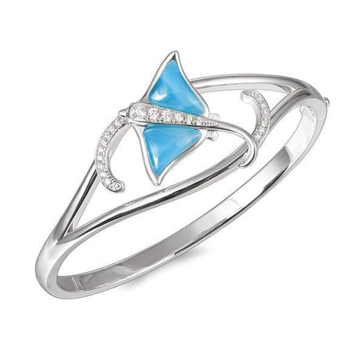 The picture shows a 925 sterling silver larimar eagle ray bangle with topaz.