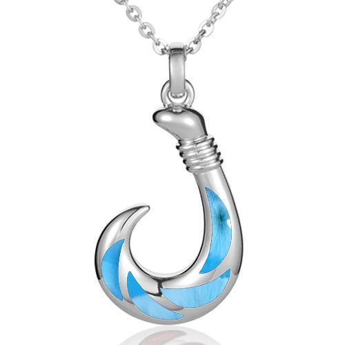 In this photo there is a sterling silver fish hook pendant with blue larimar gemstones.