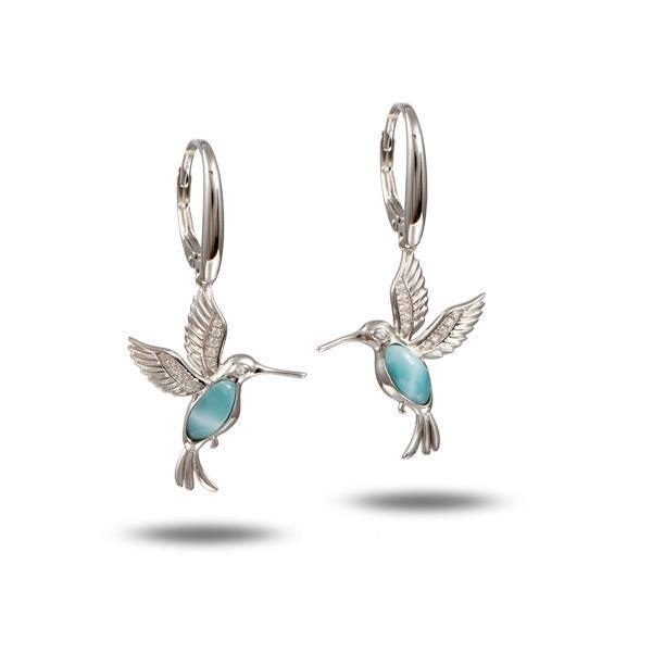 In this photo there is a pair of 925 sterling silver flying hummingbird lever-back earrings with blue larimar and topaz gemstones.