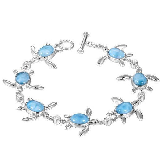 The picture shows a 925 sterling silver sea turtle charm bracelet with larimar gemstones and cubic zirconia.