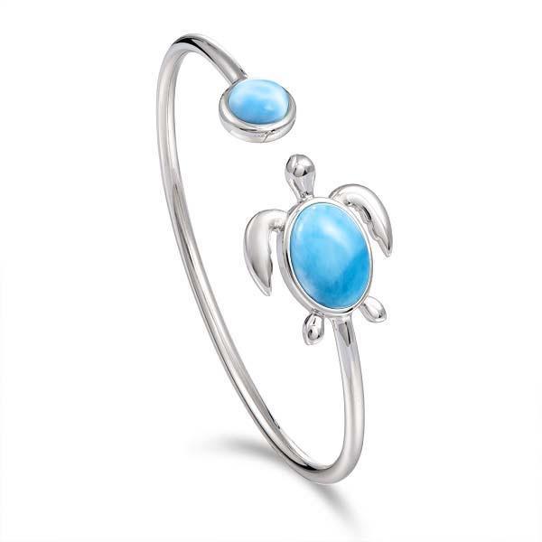 The picture shows a 925 sterling silver sea turtle bangle bracelet with two larimar gemstones.