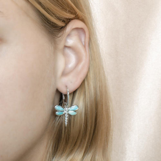 In this photo is a model wearing 925 sterling silver dragonfly lever-back earrings with blue larimar and aquamarine gemstones.
