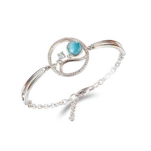 In this photo there is a 925 sterling silver bracelet with larimar, topaz, and aquamarine gemstones.