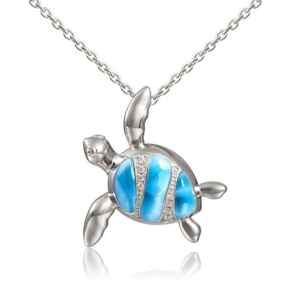 The picture shows a 925 sterling silver larimar sea turtle pendant with topaz.