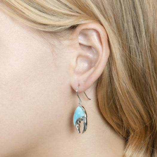 The picture shows a model wearing a 925 sterling silver larimar lobster hook earring.