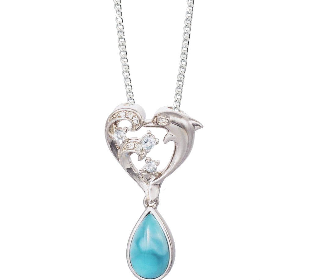 The picture shows a sterling silver larimar dolphin pendant with a heart and wave motif, aquamarines, and topaz.