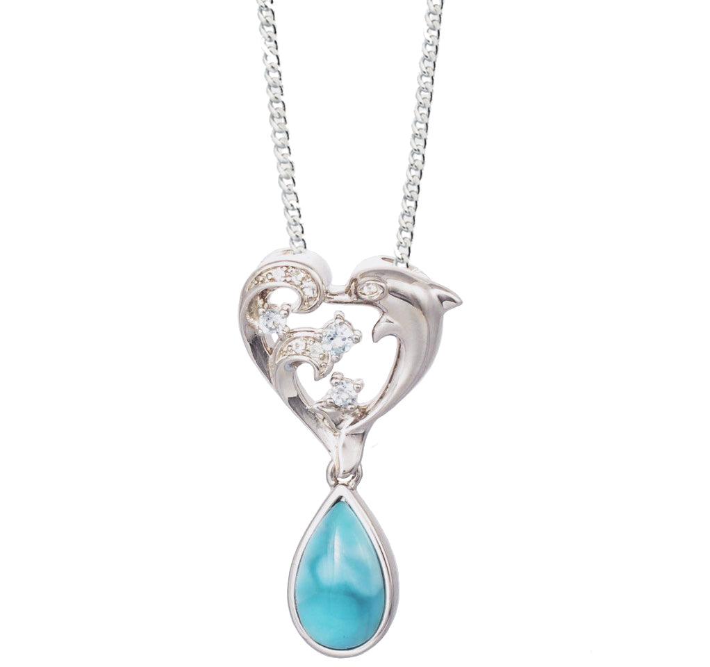 The picture shows a sterling silver larimar dolphin pendant with a heart and wave motif, aquamarines, and topaz.