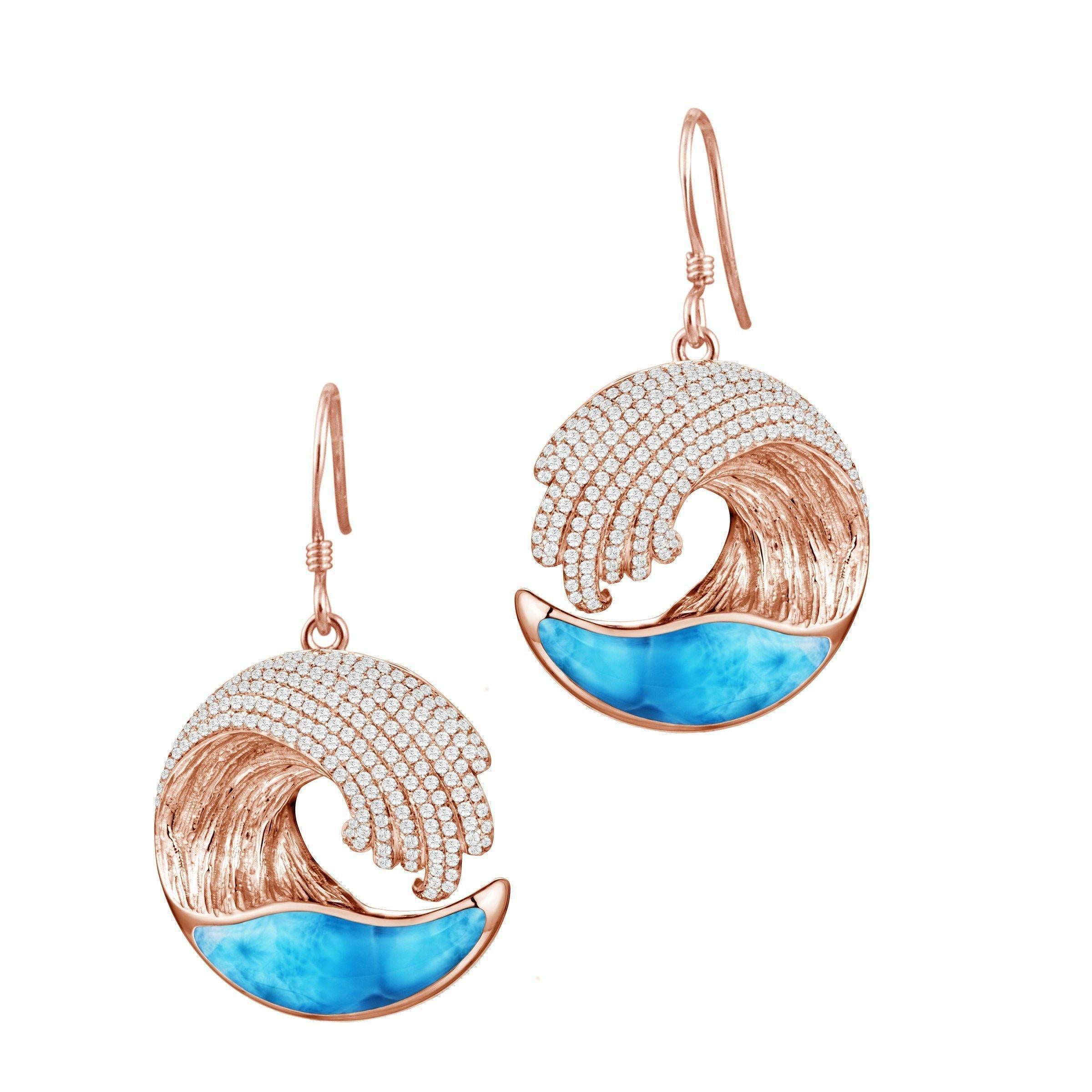 The picture shows 14k rose gold larimar ocean wave earrings with diamonds.