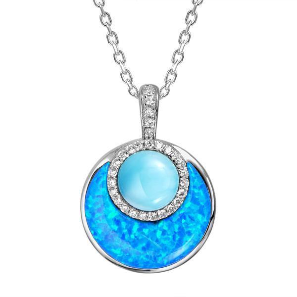 In this photo there is a sterling silver circle pendant with blue larimar, opalite, and topaz gemstones.