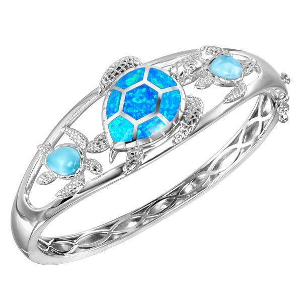 The picture shows a 925 sterling silver larimar and opalite 3 sea turtle bangle.
