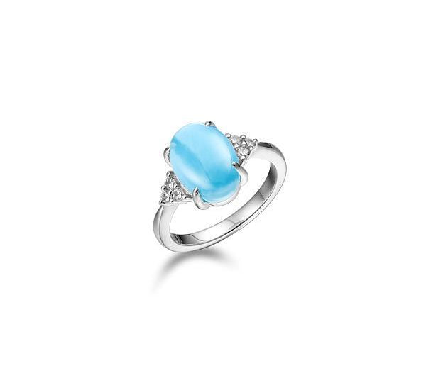 The picture shows a 925 sterling silver larimar oval ring with topaz.