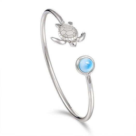 The picture shows a 925 sterling silver larimar sea turtle bangle.