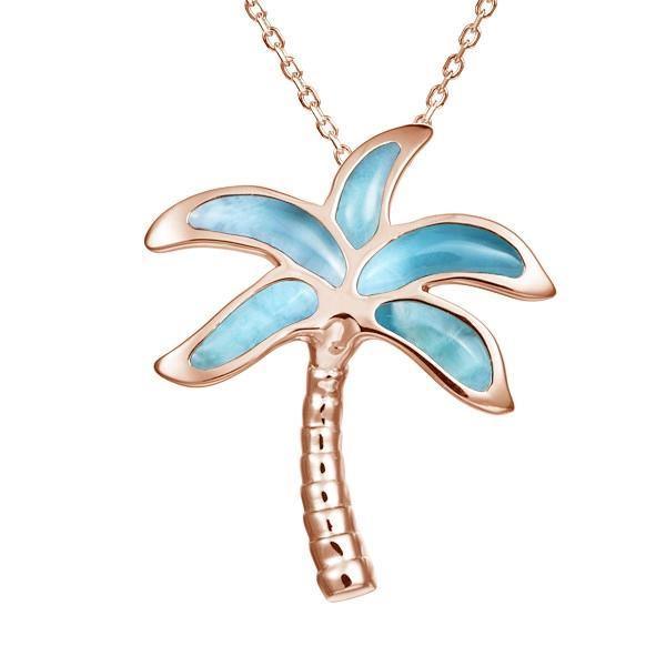 In this photo there is a rose gold palm tree pendant with blue larimar gemstones.