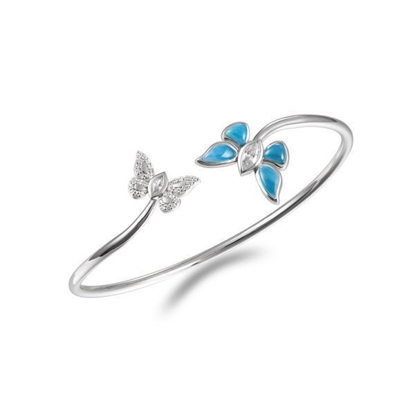In this photo there is a sterling silver bangle with two butterflies and blue larimar, topaz, and aquamarine gemstones.